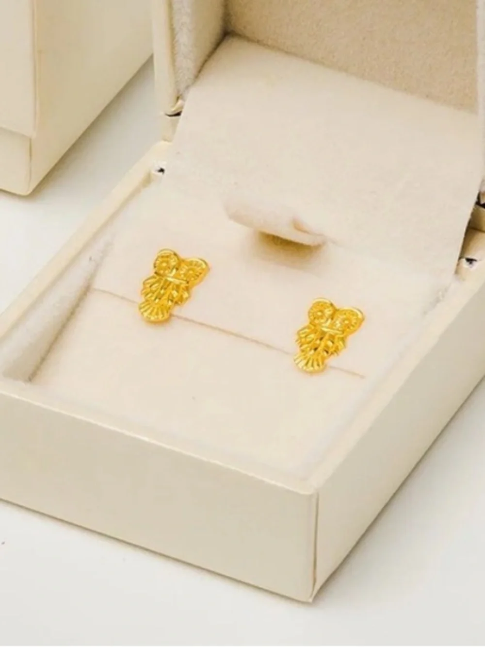 Pure Luxuries London owl earrings
